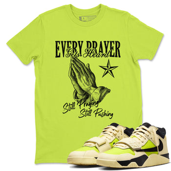 Every Prayer Gets Heard sneaker match t-shirt styled to complete your fit with the Jordan Jumpman Jack Travis Scott Bright Cactus sneakers, shown in Safety Green 1.