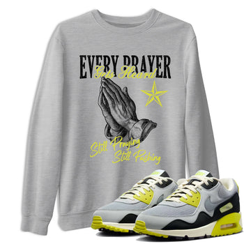 Every Prayer Gets Heard sneaker match t-shirt styled to complete your fit with the Air Max 90 Cyber sneakers, shown in Heather Grey 1.