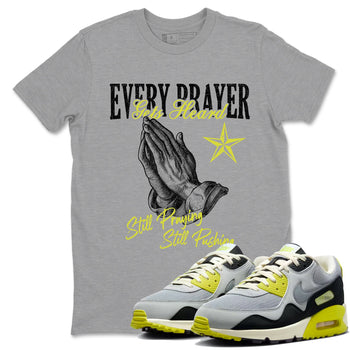 Every Prayer Gets Heard sneaker match t-shirt styled to complete your fit with the Air Max 90 Cyber sneakers, shown in Heather Grey 1.