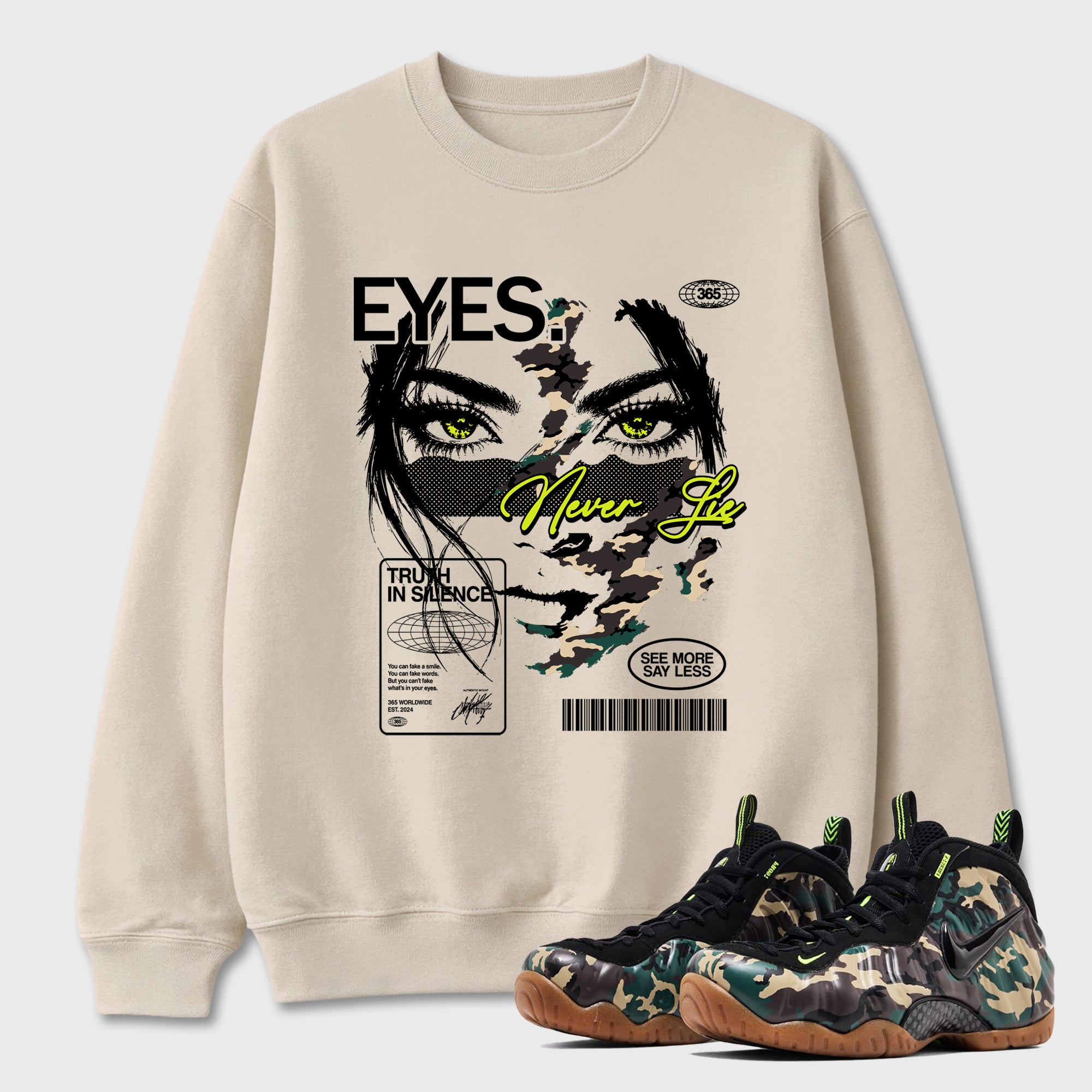 Eyes Never Lie Graphic T-Shirt featuring original streetwear artwork designed to match the Air Foamposite Pro Green Camo. Natural 1 Graphic Tee.