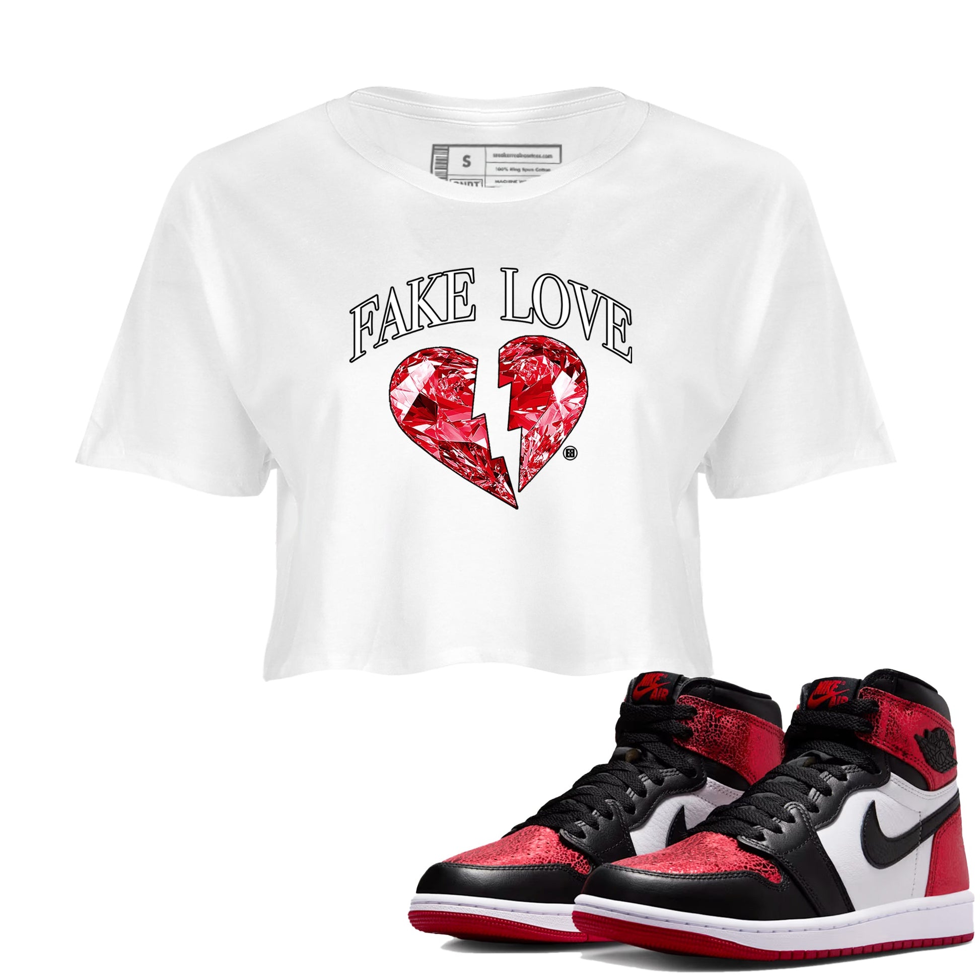 Fake Love womens crop tee made to vibe with the Air Jordan 1 Ruby sneakers — the perfect match in White 1.