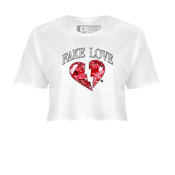 Fake Love womens crop tee made to vibe with the Air Jordan 1 Ruby sneakers — the perfect match in White 2.