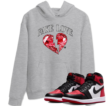 Fake Love sneaker match t-shirt styled to complete your fit with the Air Jordan 1 Ruby sneakers, shown in Heather Grey 1.
