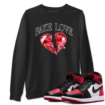Fake Love sneaker match t-shirt styled to complete your fit with the Air Jordan 1 Ruby sneakers, shown in Black 1.