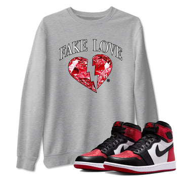 Fake Love sneaker match t-shirt styled to complete your fit with the Air Jordan 1 Ruby sneakers, shown in Heather Grey 1.