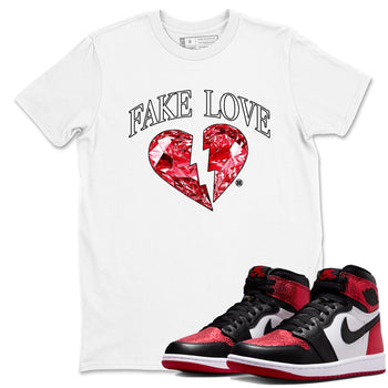 Fake Love sneaker match t-shirt styled to complete your fit with the Air Jordan 1 Ruby sneakers, shown in White 1.