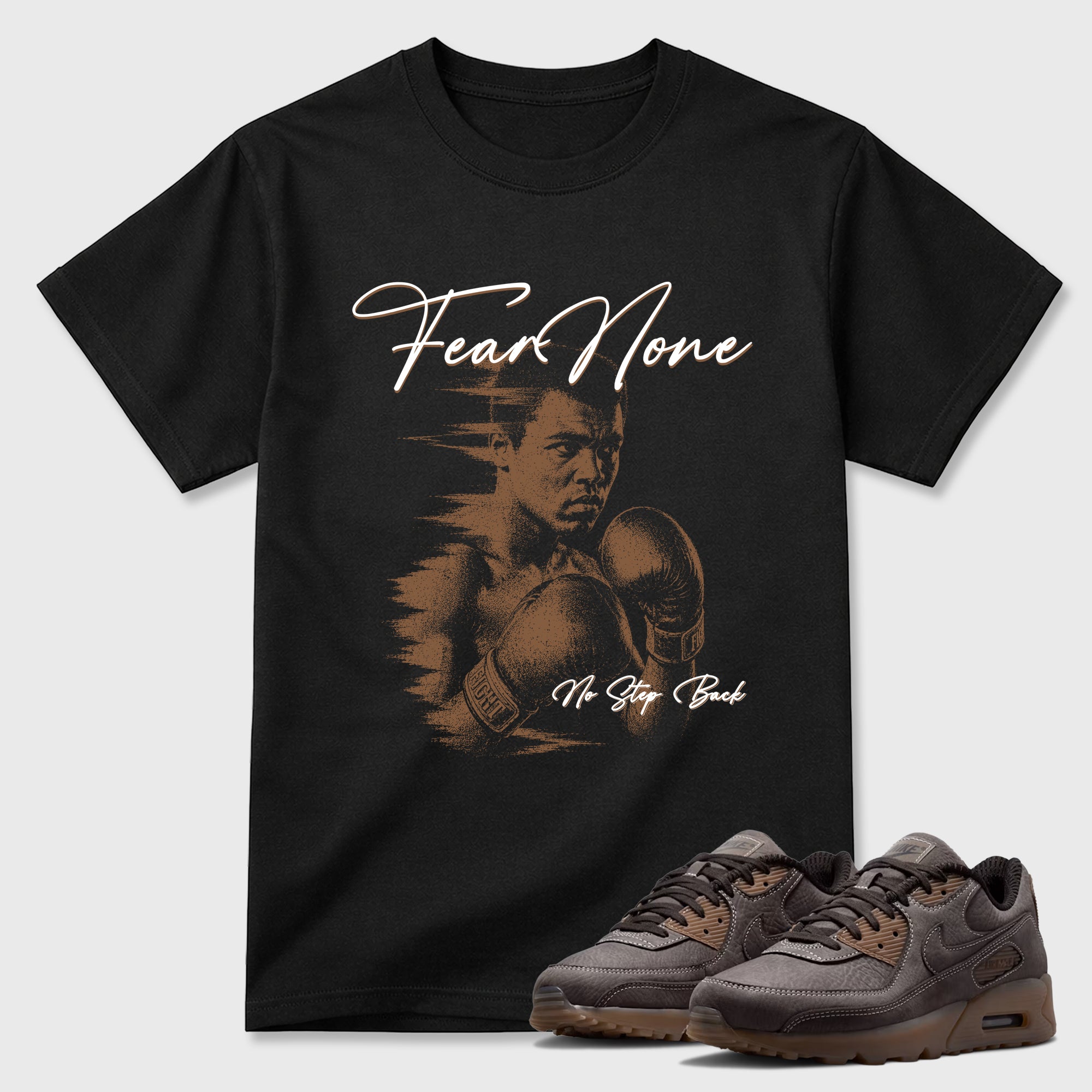 Fear None Graphic T-Shirt featuring original streetwear artwork designed to match the Air Max 90 Shadow Brown. Black 1 Graphic T-Shirt.