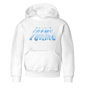 Foams baby and kids t-shirt crafted for little sneakerheads to shine with the Air Foamposite One Psychic Blue sneakers, displayed in White 2.