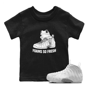 Foams So Fresh baby and kids t-shirt crafted for little sneakerheads to shine with the Air Foamposite One Triple White sneakers, displayed in Black 1.