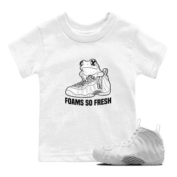Foams So Fresh baby and kids t-shirt crafted for little sneakerheads to shine with the Air Foamposite One Triple White sneakers, displayed in White 1.