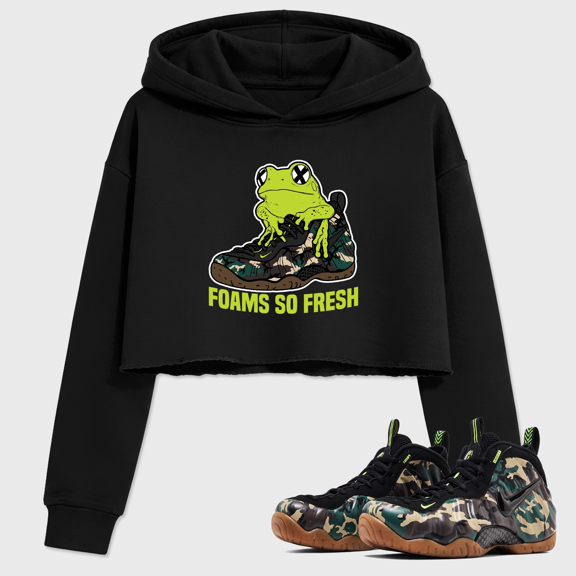 Foams So Fresh Women’s Graphic Crop Tee featuring original streetwear artwork designed to match the Air Foamposite Pro Green Camo. Black 1 Crop Tee.