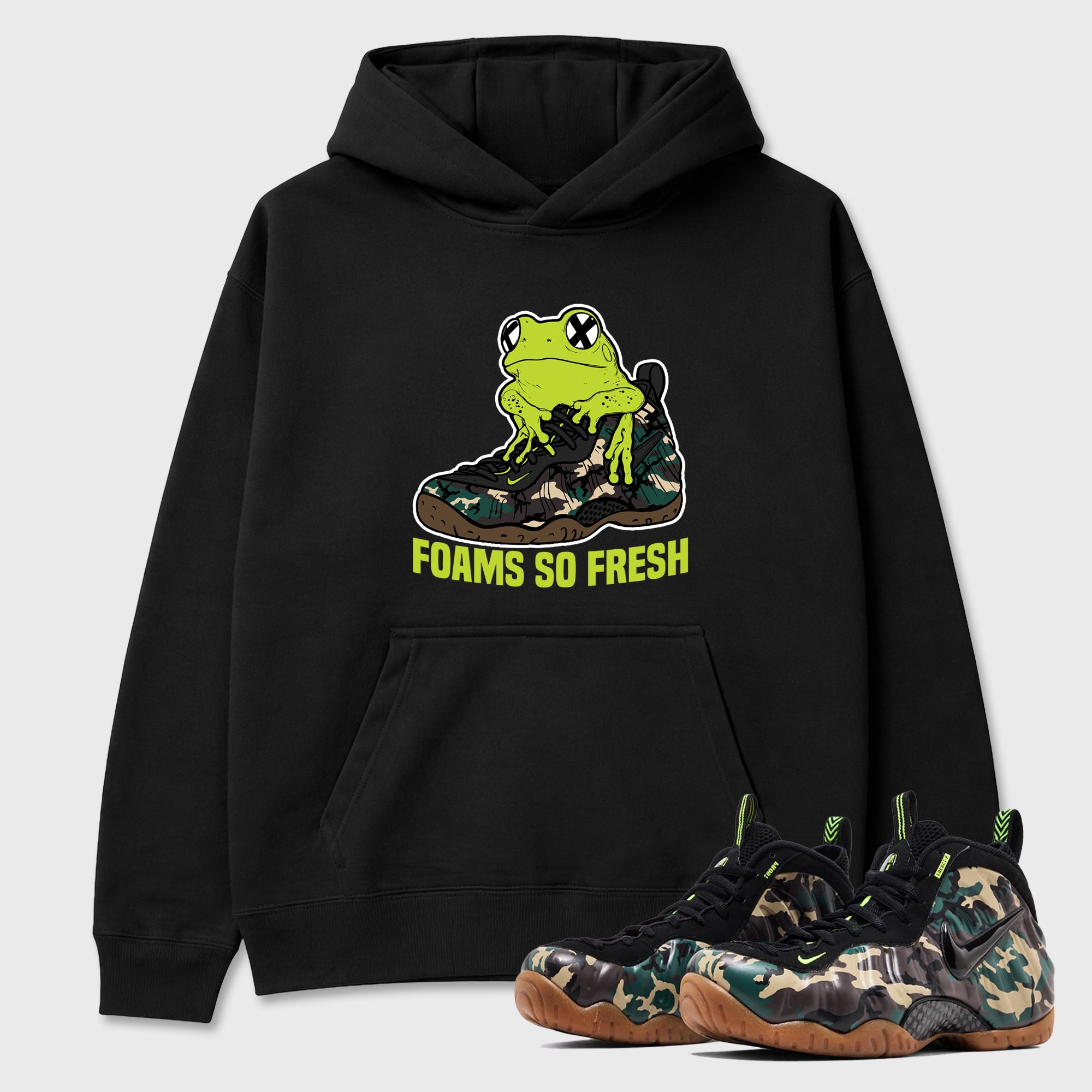Foams So Fresh Graphic T-Shirt featuring original streetwear artwork designed to match the Air Foamposite Pro Green Camo. Black 1 Graphic Tee.