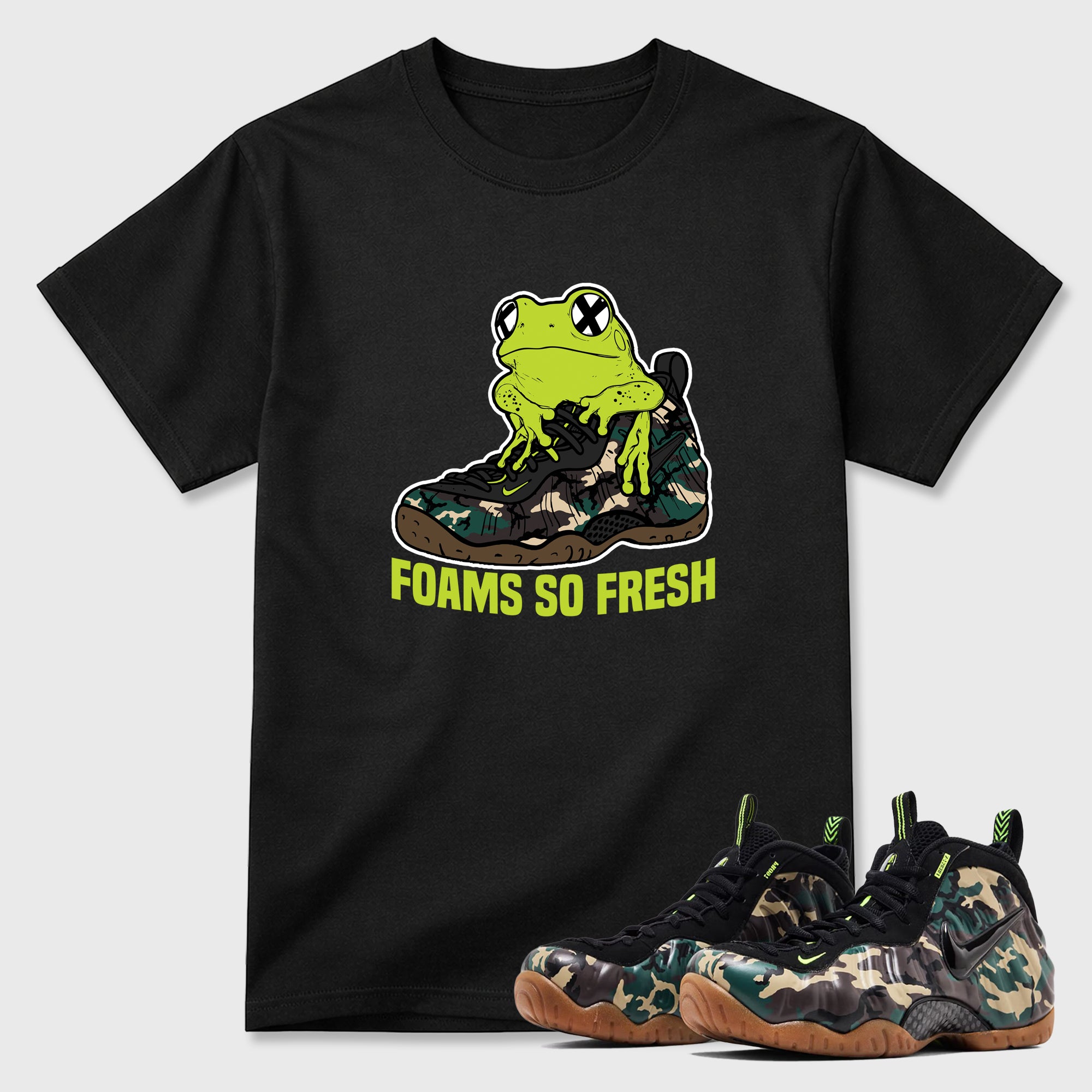 Foams So Fresh Graphic T-Shirt featuring original streetwear artwork designed to match the Air Foamposite Pro Green Camo. Black 1 Graphic T-Shirt.