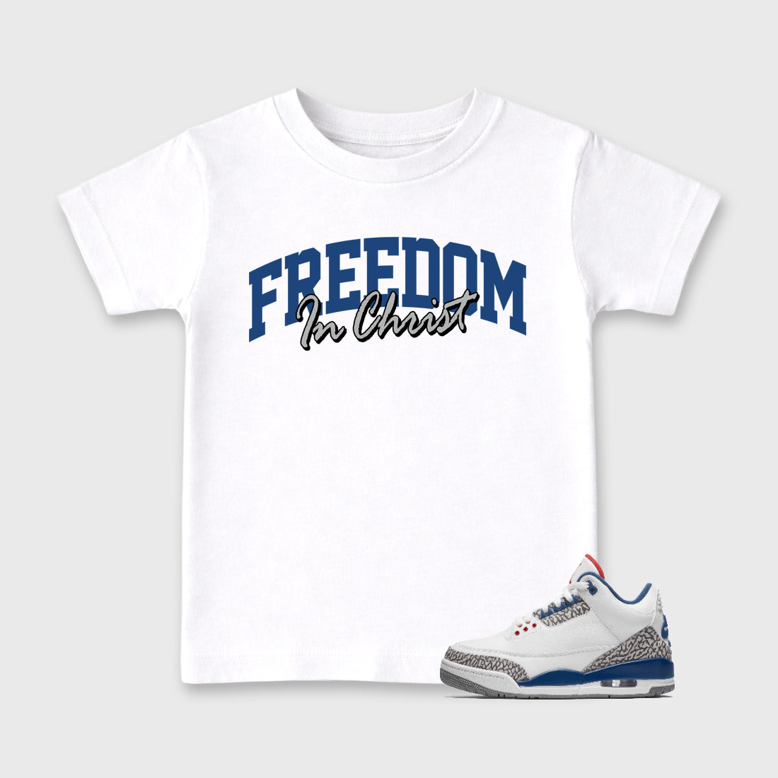 Freedom In Christ Baby & Kids Graphic T-Shirt featuring original artwork designed to match the Air Jordan 3 True Blue. White 1 Kids Graphic Tee.
