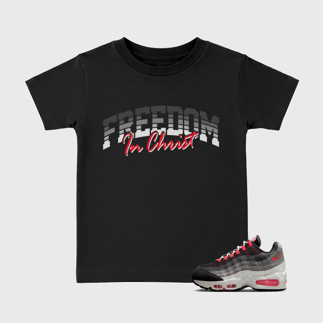 Freedom In Christ Baby & Kids Graphic T-Shirt featuring original artwork designed to match the Air Max 95 Reverse Solar Red. Black 1 Kids Graphic Tee.