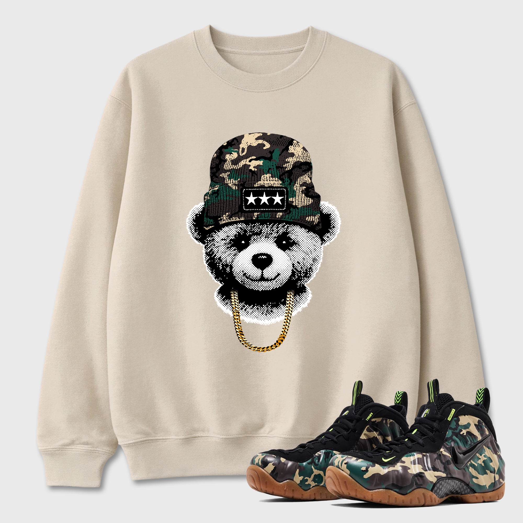 Gangster Teddy Graphic T-Shirt featuring original streetwear artwork designed to match the Air Foamposite Pro Green Camo. Natural 1 Graphic Tee.