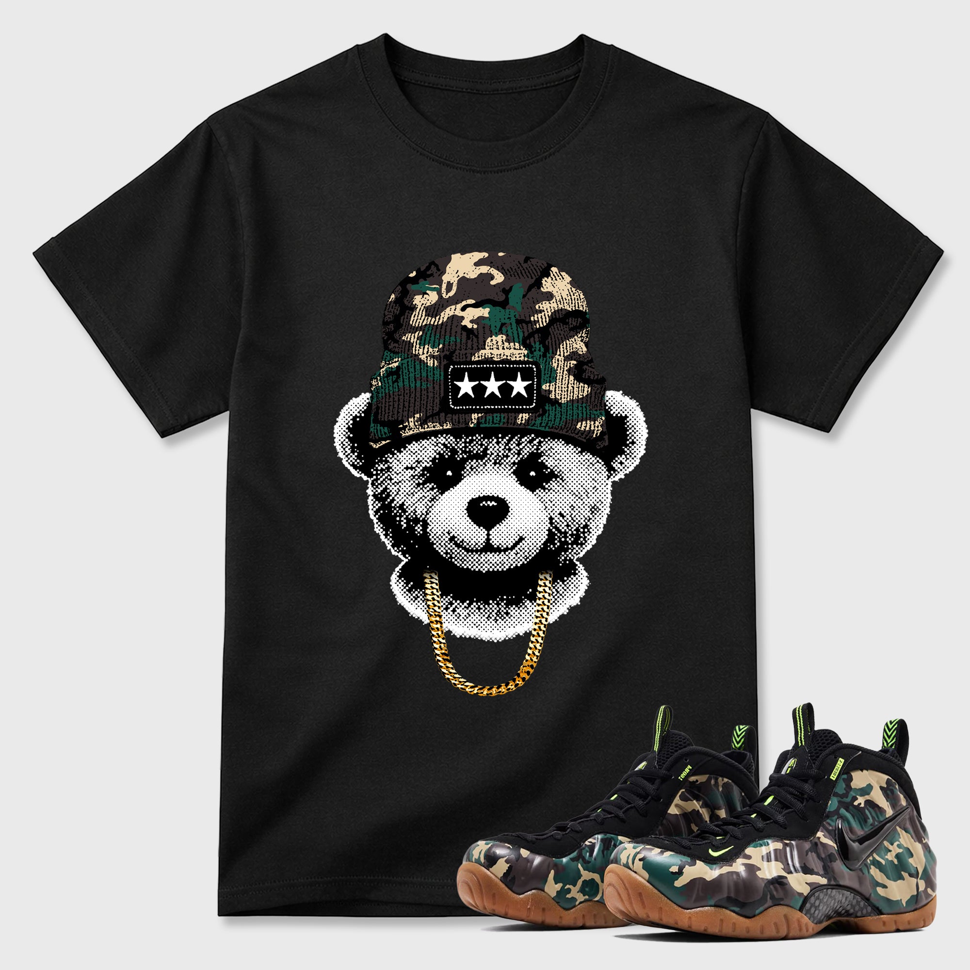 Gangster Teddy Graphic T-Shirt featuring original streetwear artwork designed to match the Air Foamposite Pro Green Camo. Black 1 Graphic T-Shirt.
