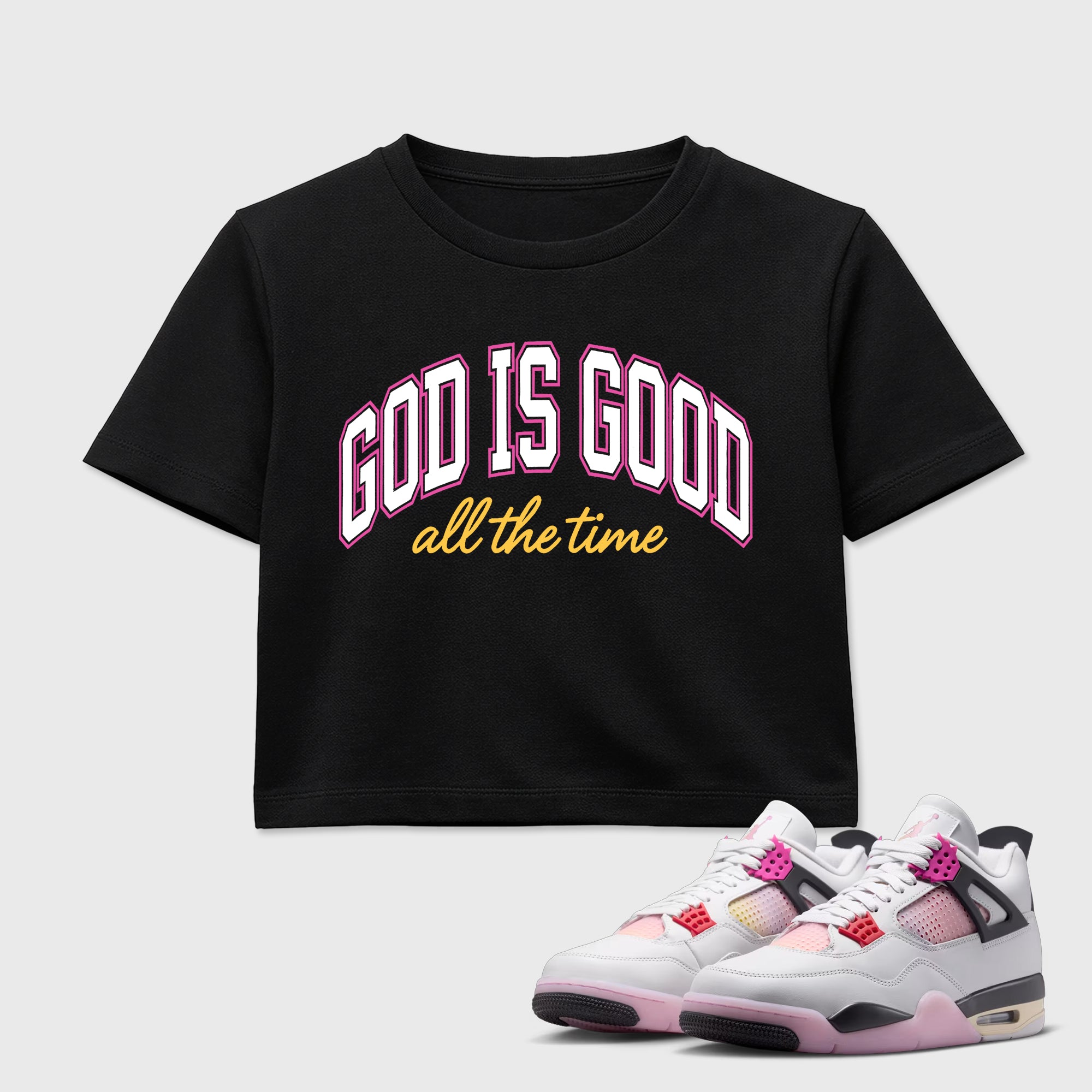 God Is Good women’s crop tee designed to match the Air Jordan 4 Comic, featuring coordinated Black 1 options for a perfect streetwear vibe.