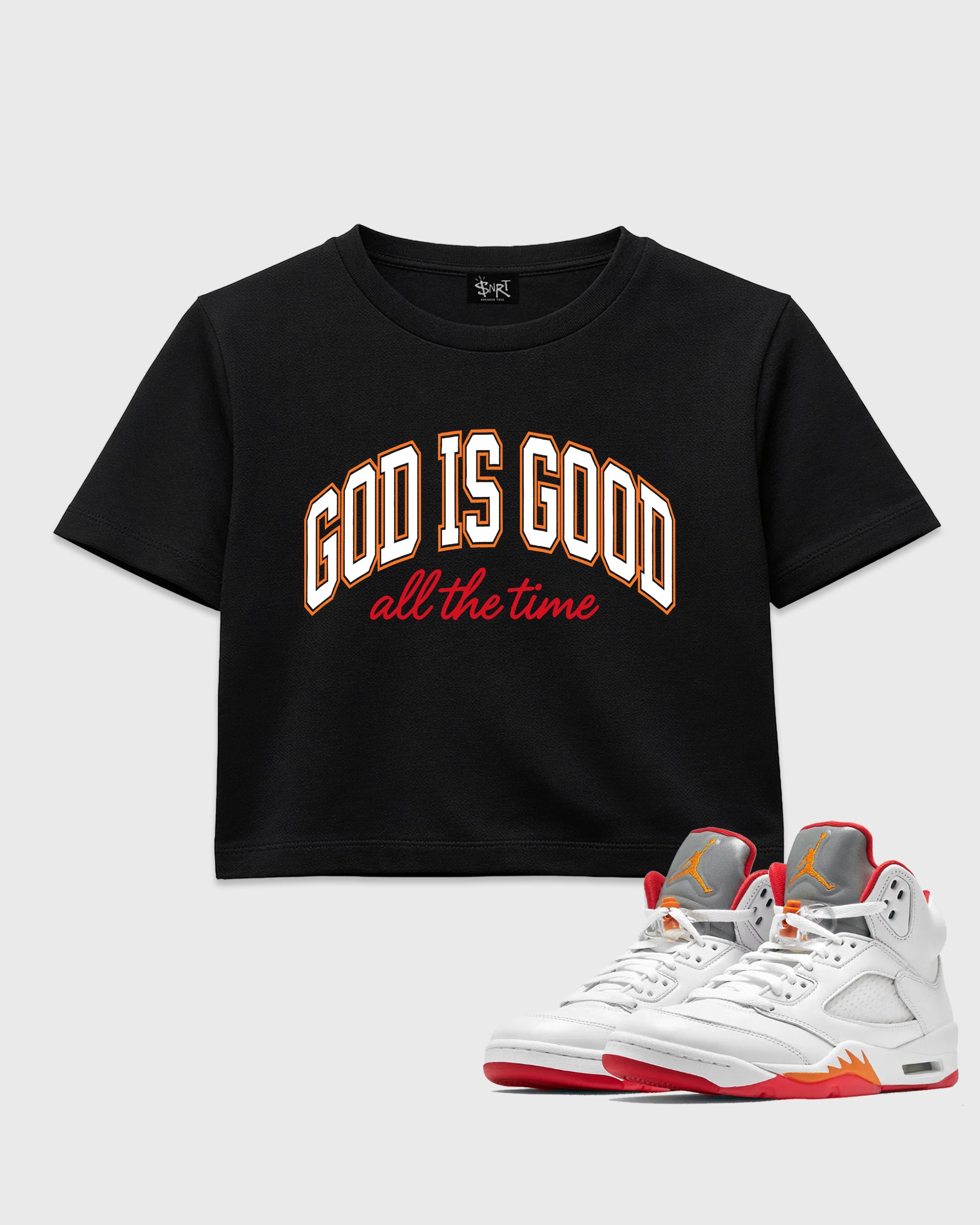 God Is Good women’s crop tee designed to match the Air Jordan 5 Sunset, featuring coordinated Black 1 options for a perfect streetwear vibe.