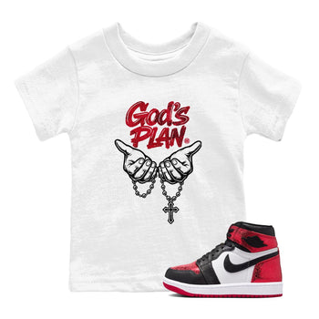 God's Plan baby and kids t-shirt crafted for little sneakerheads to shine with the Air Jordan 1 Ruby sneakers, displayed in White 1.