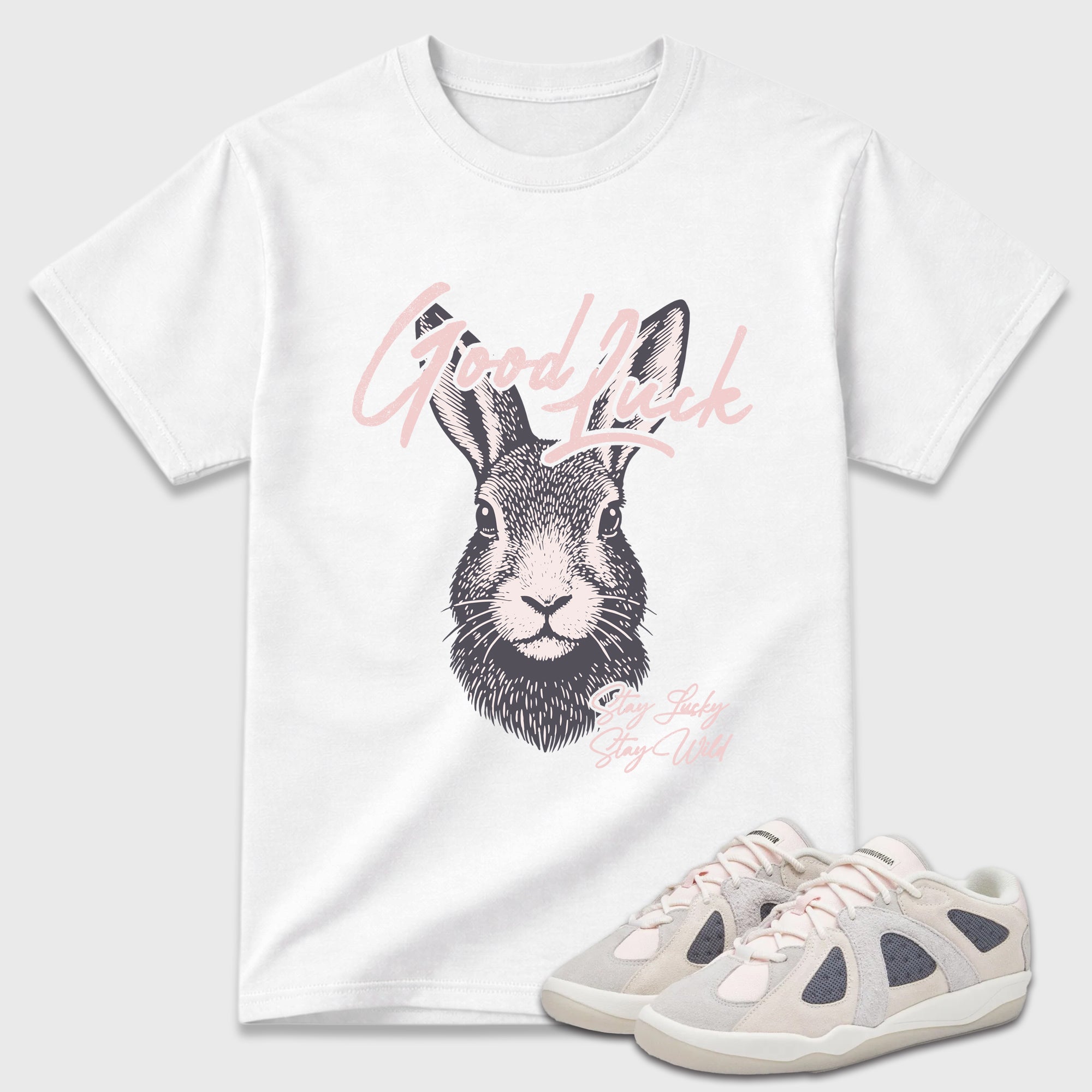 Good Luck Graphic T-Shirt featuring original streetwear artwork designed to match the Badbo 1.0 Chalk White Pink. White 1 Graphic T-Shirt.