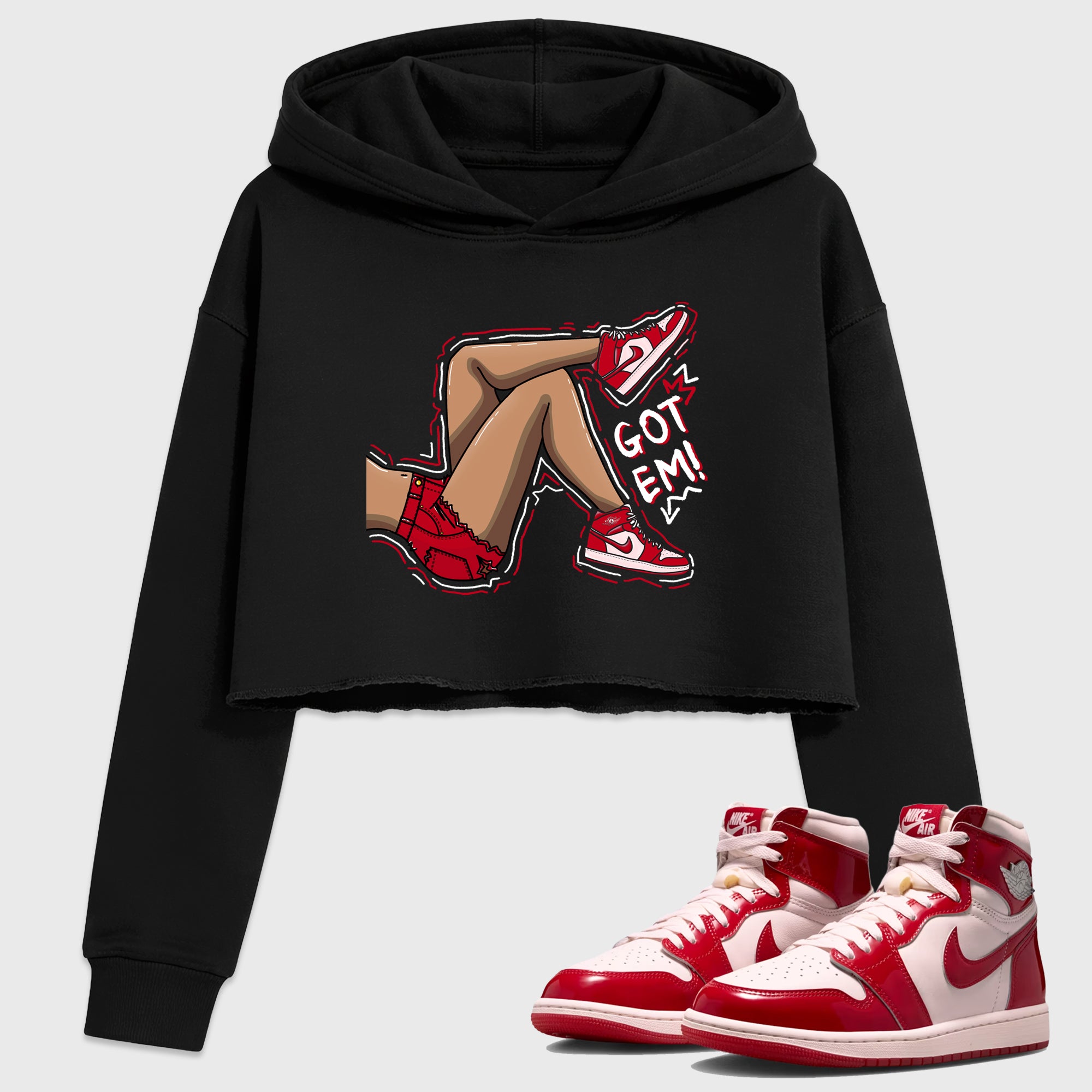 Got Em Legs Women’s Graphic Crop Tee featuring original streetwear artwork designed to match the Air Jordan 1 Nails and Grails. Black 1 Crop Tee.
