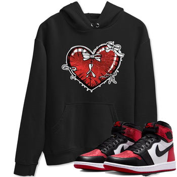 Heart With Ribbons sneaker match t-shirt styled to complete your fit with the Air Jordan 1 Ruby sneakers, shown in Black 1.
