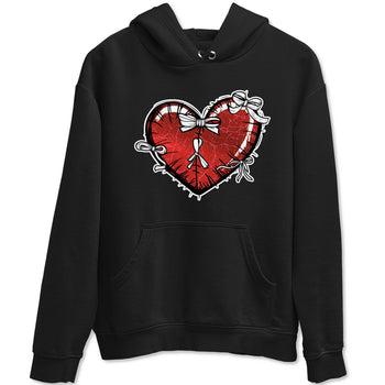 Heart With Ribbons sneaker match t-shirt styled to complete your fit with the Air Jordan 1 Ruby sneakers, shown in Black 2.