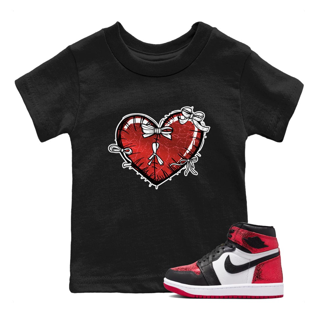 Heart With Ribbons baby and kids t-shirt crafted for little sneakerheads to shine with the Air Jordan 1 Ruby sneakers, displayed in Black 1.