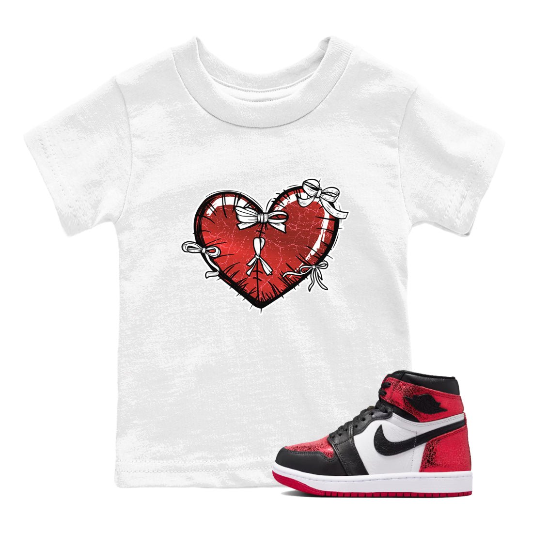 Heart With Ribbons baby and kids t-shirt crafted for little sneakerheads to shine with the Air Jordan 1 Ruby sneakers, displayed in White 1.