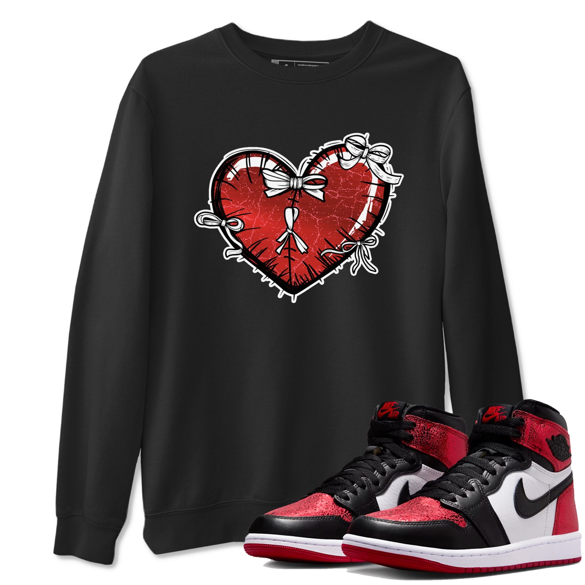 Heart With Ribbons sneaker match t-shirt styled to complete your fit with the Air Jordan 1 Ruby sneakers, shown in Black 1.