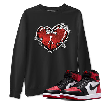 Heart With Ribbons sneaker match t-shirt styled to complete your fit with the Air Jordan 1 Ruby sneakers, shown in Black 1.