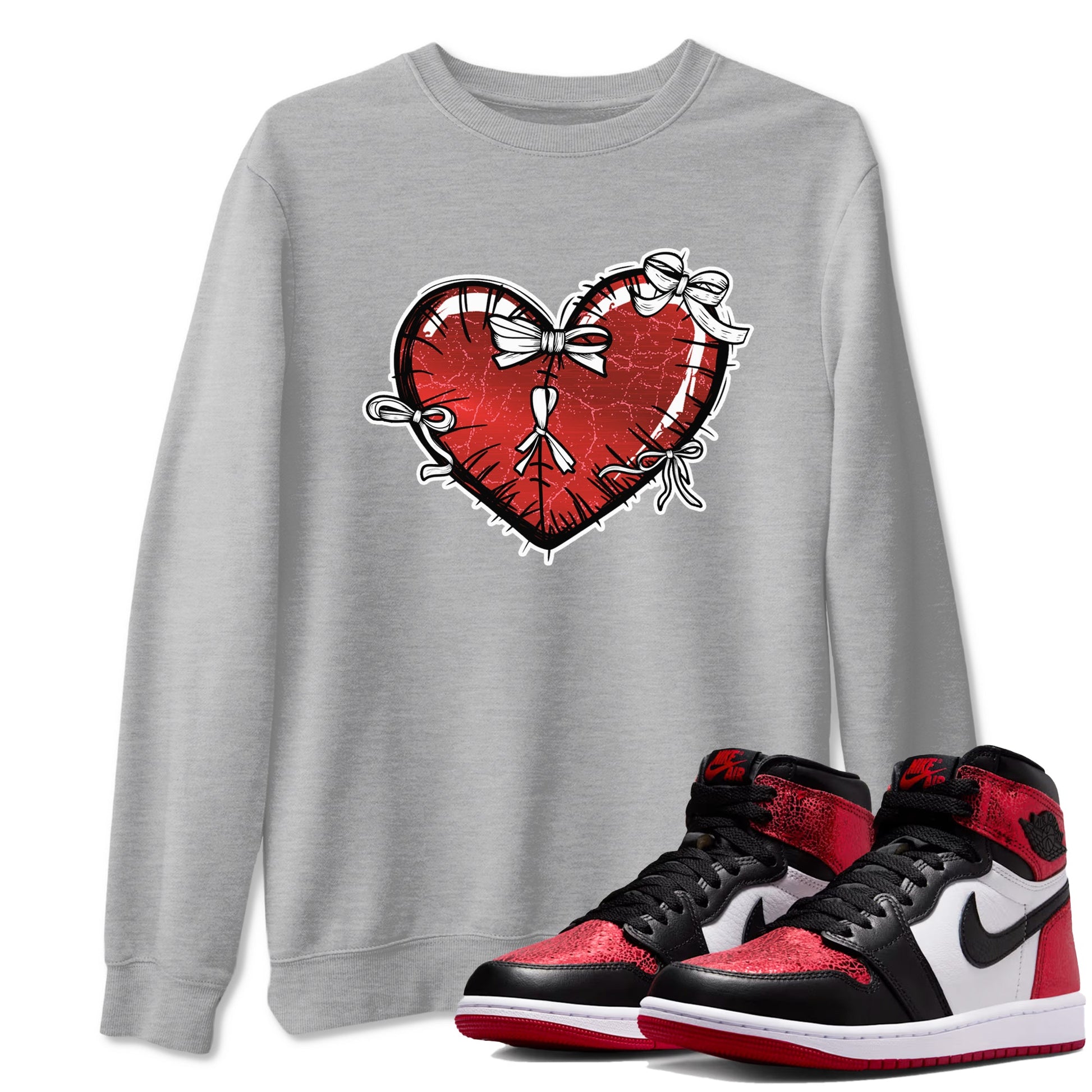Heart With Ribbons sneaker match t-shirt styled to complete your fit with the Air Jordan 1 Ruby sneakers, shown in Heather Grey 1.
