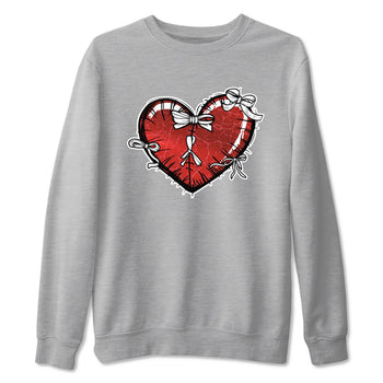 Heart With Ribbons sneaker match t-shirt styled to complete your fit with the Air Jordan 1 Ruby sneakers, shown in Heather Grey 2.