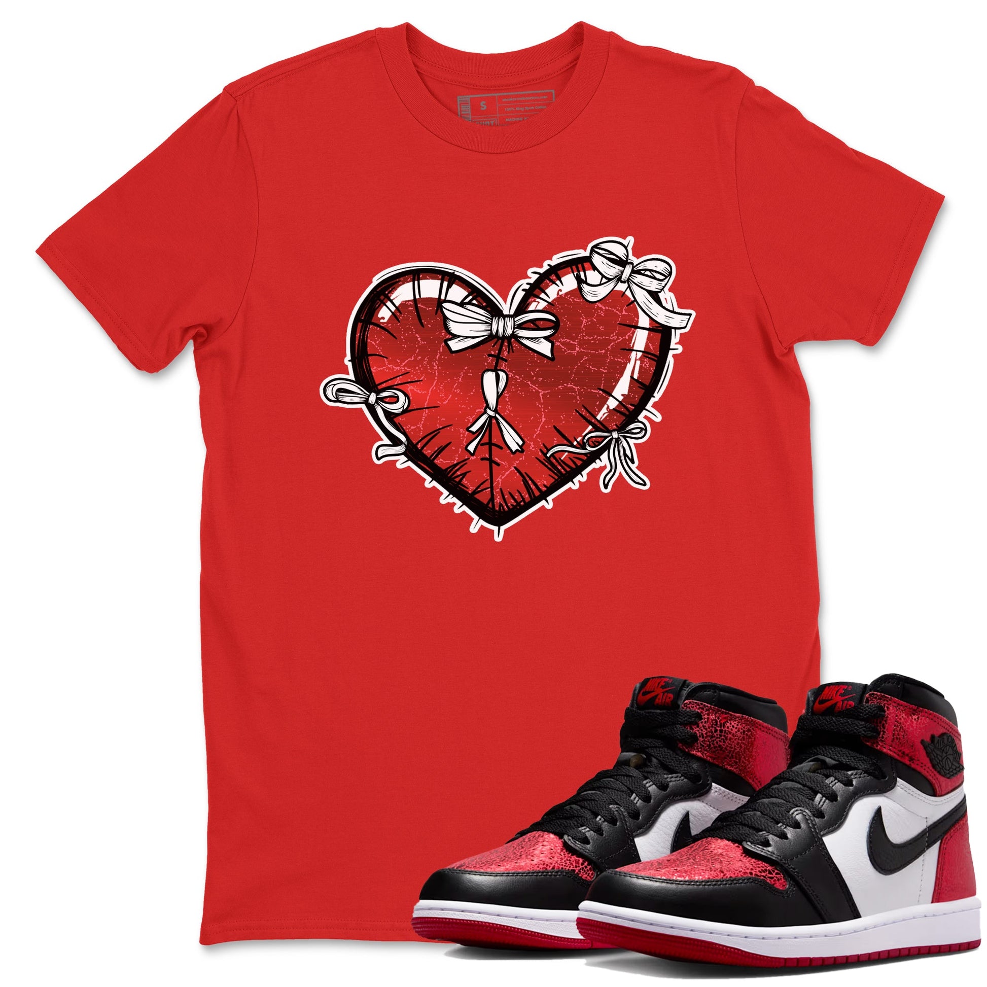 Heart With Ribbons sneaker match t-shirt styled to complete your fit with the Air Jordan 1 Ruby sneakers, shown in Red 1.