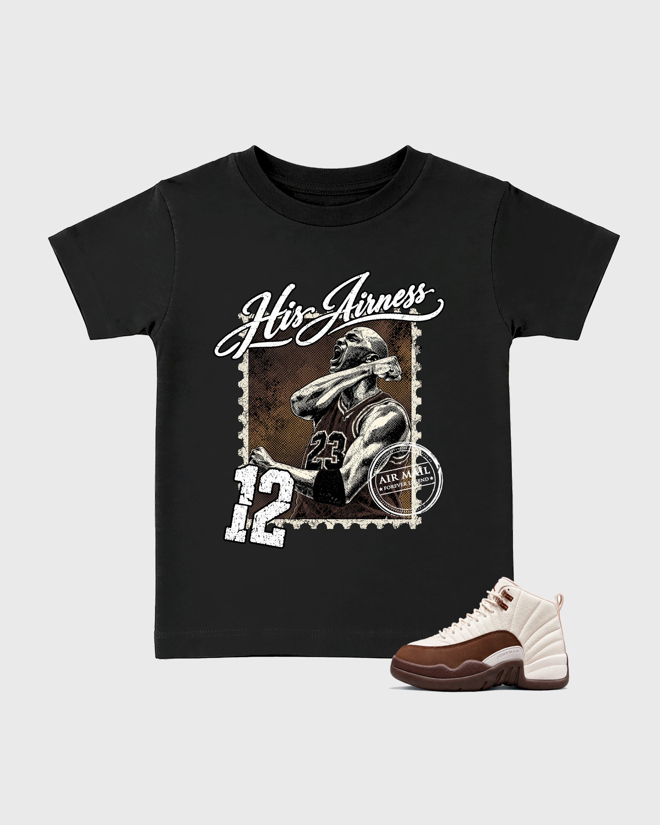 His Airness Baby & Kids Graphic T-Shirt featuring original artwork designed to match the Air Jordan 12 Fireside. Black 1 Kids Graphic Tee.