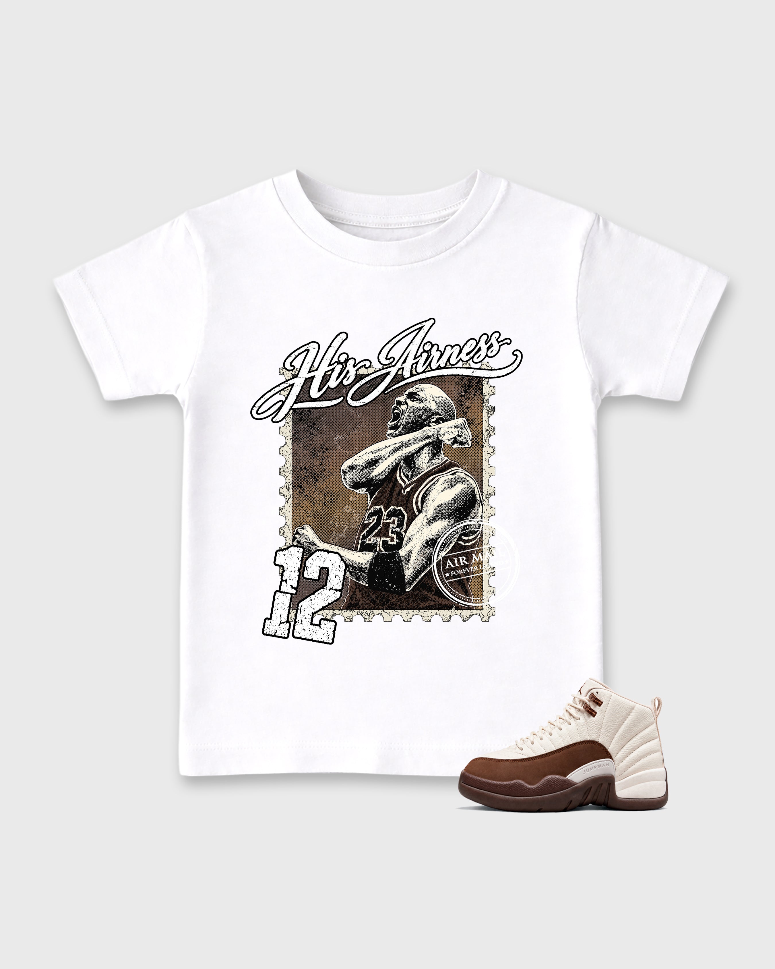 His Airness Baby & Kids Graphic T-Shirt featuring original artwork designed to match the Air Jordan 12 Fireside. White 1 Kids Graphic Tee.