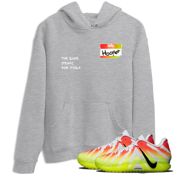 Sneaker Threads – Sneaker Tees To Match Nike JA 3 Under The Christmas Tree – Hooper Badge Graphic Tee Heather Grey 1. Perfect for Jordan releases 2025 colorways. Perfect for Ja Morant sneaker releases and Christmas 2025 colorways.