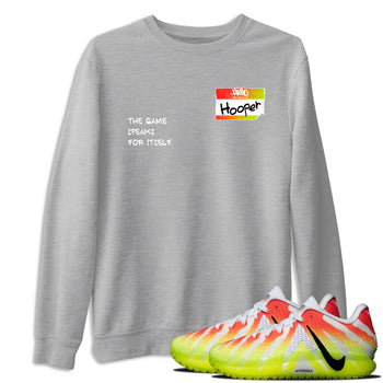 Sneaker Threads – Sneaker Tees To Match Nike JA 3 Under The Christmas Tree – Hooper Badge Graphic Tee Heather Grey 1. Perfect for Jordan releases 2025 colorways. Perfect for Ja Morant sneaker releases and Christmas 2025 colorways.