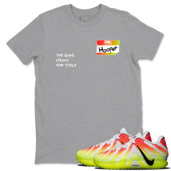 Sneaker Threads – Sneaker Tees To Match Nike JA 3 Under The Christmas Tree – Hooper Badge Graphic Tee Heather Grey 1. Perfect for Jordan releases 2025 colorways. Perfect for Ja Morant sneaker releases and Christmas 2025 colorways.