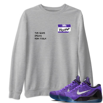 Sneaker Threads – Sneaker Tees To Match Nike KB 9 Hyper Grape – Hooper Badge Graphic Tee Heather Grey 1. Perfect for Jordan releases 2025 colorways. Perfect for purple basketball sneaker releases and legacy-inspired colorways for 2025 hoopers.
