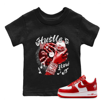 Hustle and Flow baby and kids t-shirt crafted for little sneakerheads to shine with the Air Force 1 University Red sneakers, displayed in Black 1.