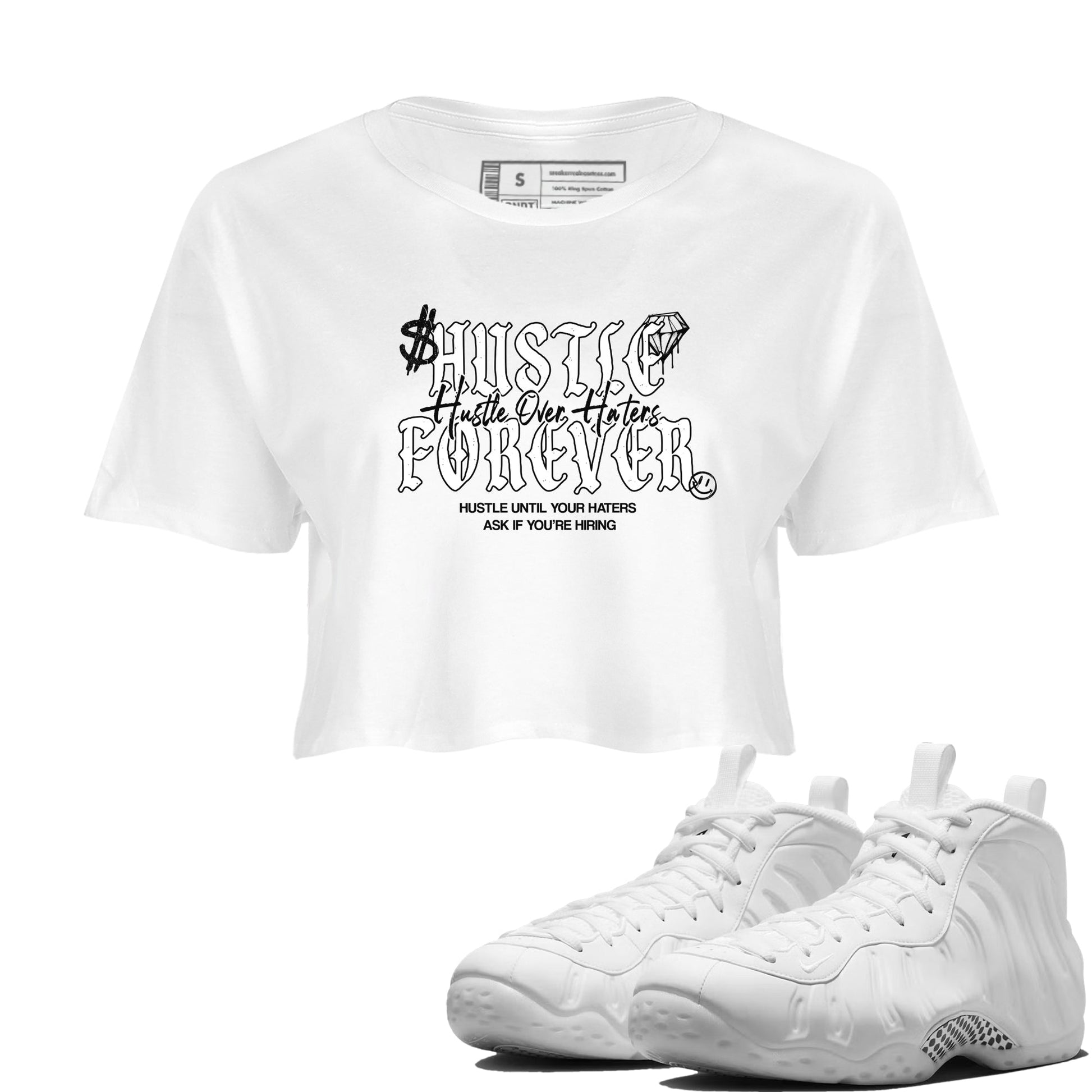 Hustle Over Haters womens crop tee made to vibe with the Air Foamposite One Triple White sneakers — the perfect match in White 1.