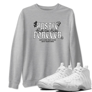 Hustle Over Haters sneaker match t-shirt styled to complete your fit with the Air Foamposite One Triple White sneakers, shown in Heather Grey 1.