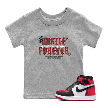 Hustle Over haters baby and kids t-shirt crafted for little sneakerheads to shine with the Air Jordan 1 Ruby sneakers, displayed in Heather Grey 1.