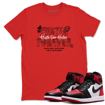Hustle Over haters sneaker match t-shirt styled to complete your fit with the Air Jordan 1 Ruby sneakers, shown in Red 1.