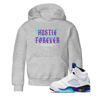 Hustle Over Haters baby and kids t-shirt crafted for little sneakerheads to shine with the Air Jordan 5 Grape sneakers, displayed in Heather Grey 1.