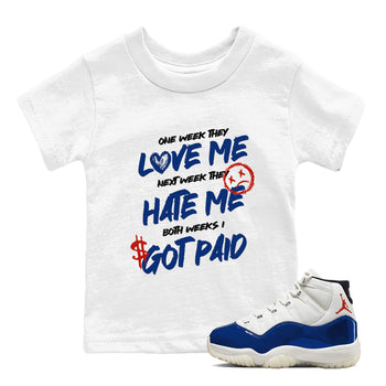 White t-shirt with humorous text design and a white sneaker with blue accents on a white background