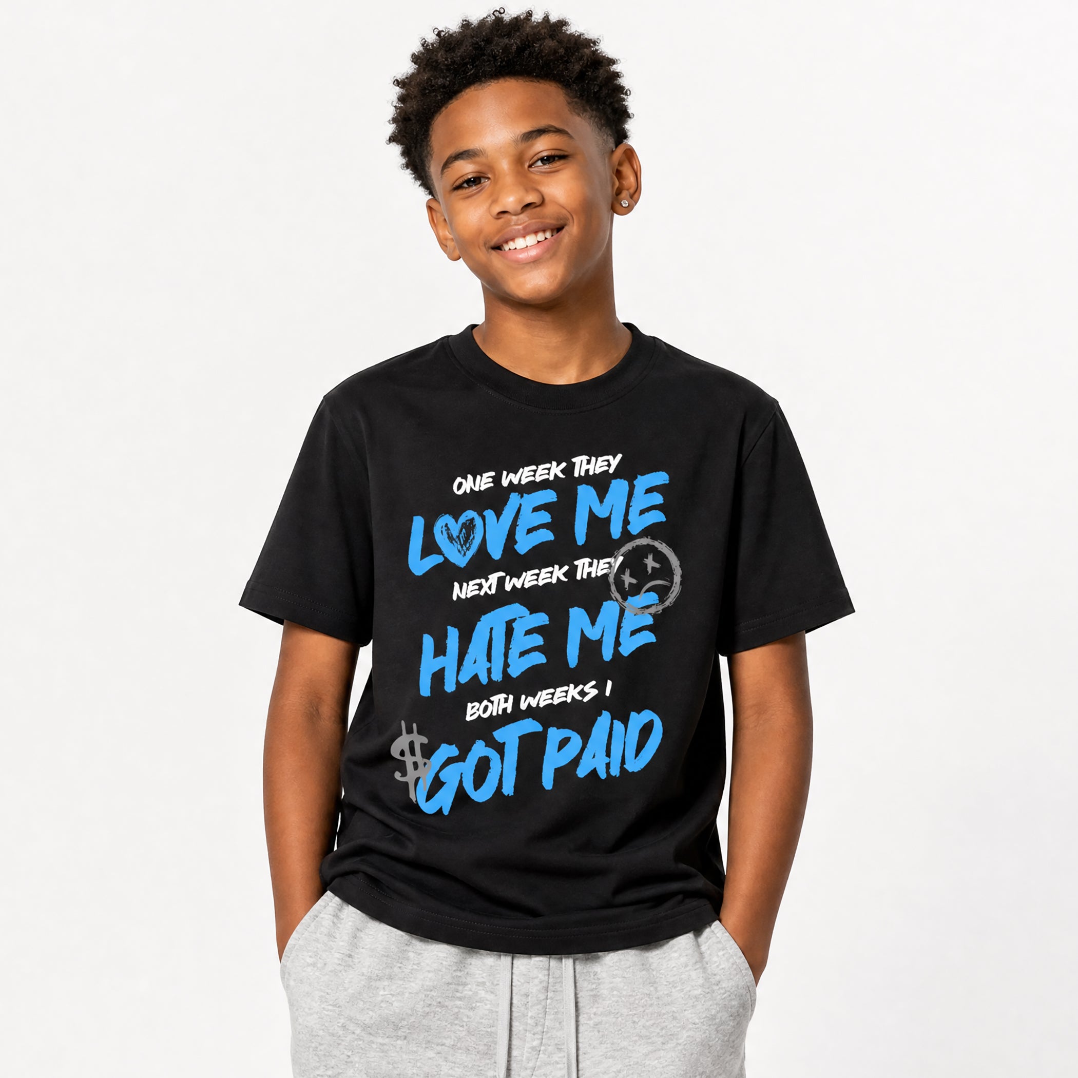 Person wearing a black t-shirt with blue text on a white background
