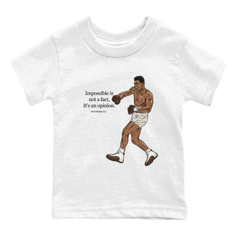 AJ12 Baroque Brown shirts to match jordans Impossible Is Not A Fact It's An Opinion best t shirts to wear with jordans SoleFly x Jordan 12 Baroque Brown match shoes to clothes SNRT Sneaker Tees Youth Baby White 2 tee